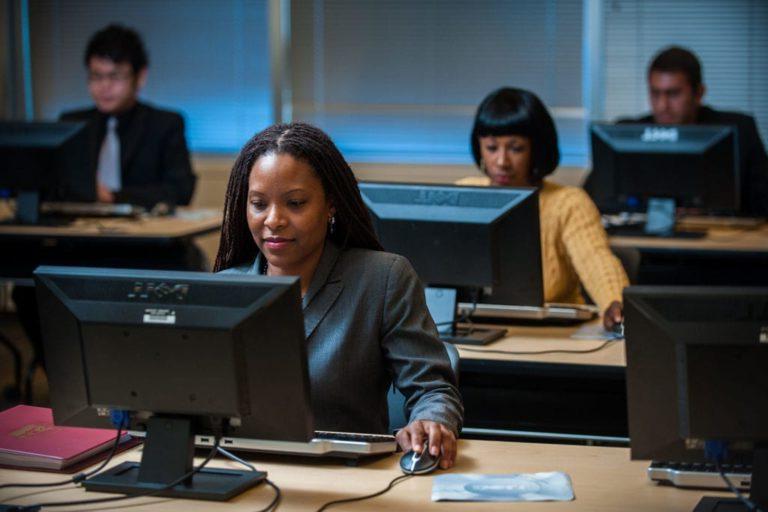 students at computers, business administration