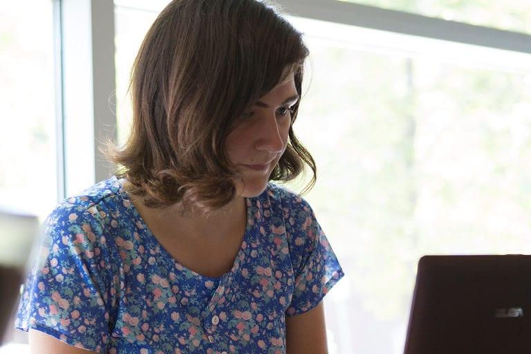 close up of woman at laptop