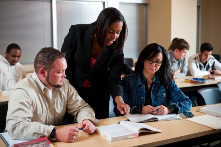 students and instructor at table