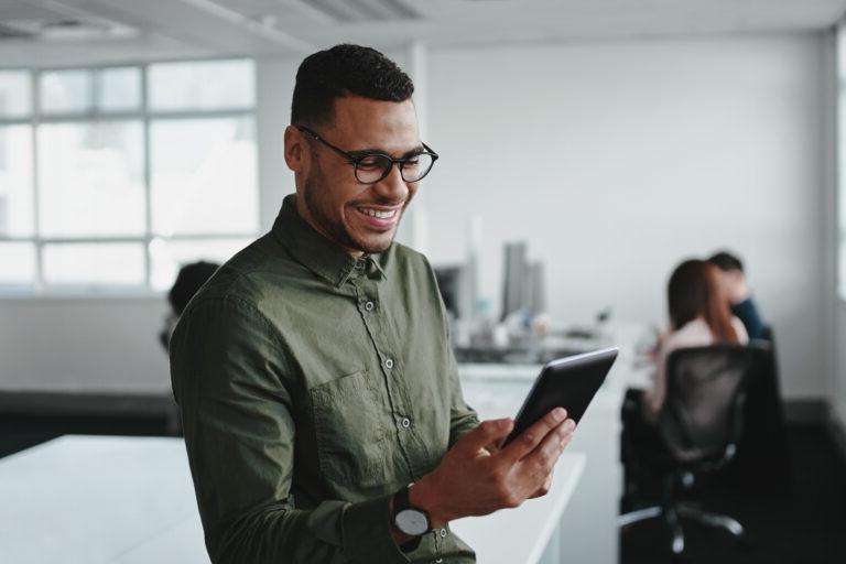 man looking at tablet